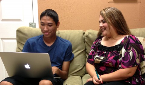 Reporter Johnny Flores interviewing Claudia Guevara, the newest member of the Mecca Community Council. Photo: IVAN DELGADO/Coachella Unincorporated